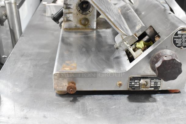 Globe 500 stainless steel commercial meat slicer with blade sharpener, missing carriage, 115 volts, 1 phase, fair condition.