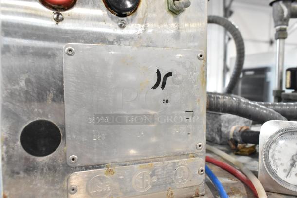 American Dish Service stainless steel commercial dishwasher, model L90-33MG. Features pass-through design, 120V, 1 phase. Visible NSF, UL markings.