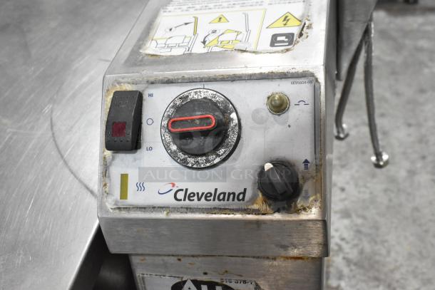 Cleveland stainless steel commercial braising pan control panel with temperature settings and warning labels. Slight wear visible.