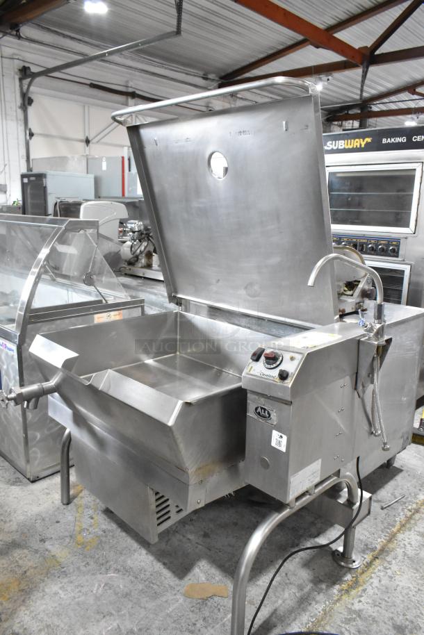 Cleveland stainless steel commercial floor-style braising pan in good condition. Features manual controls and a sturdy base.