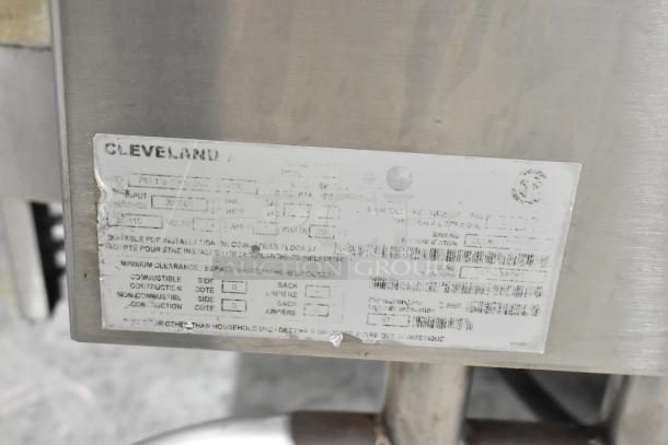 Cleveland stainless steel commercial floor braising pan, shown with manufacturer's label detailing specifications and installation requirements.