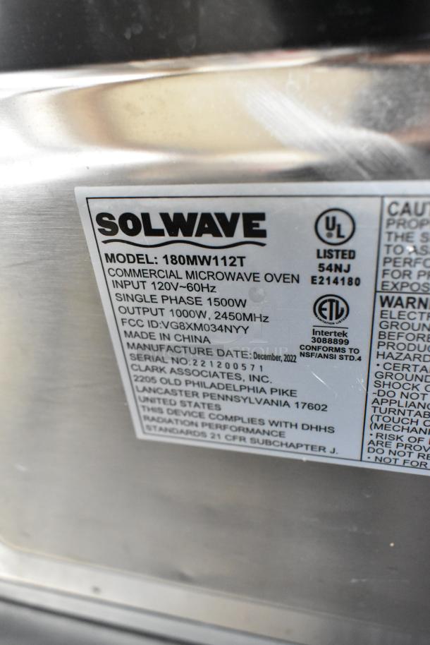 2022 Solwave 180MW112T stainless steel commercial microwave oven, 120V, 1 phase. Model label showing certifications.
