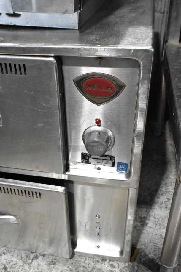 Wells RW2HD stainless steel 2-drawer warming drawer, 120V, 1 phase. Features Wells logo, temperature dial, and NSF label.