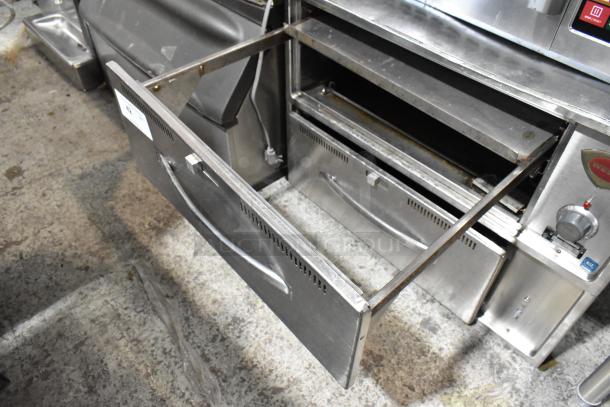 Wells RW2HD stainless steel 2-drawer commercial warming drawer. Visible wear, 120V, 1 phase. Model label intact.