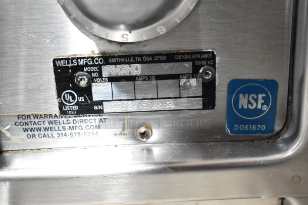Wells RW2HD stainless steel 2-drawer warming drawer, 120 volts, NSF certified, warranty contact info visible.