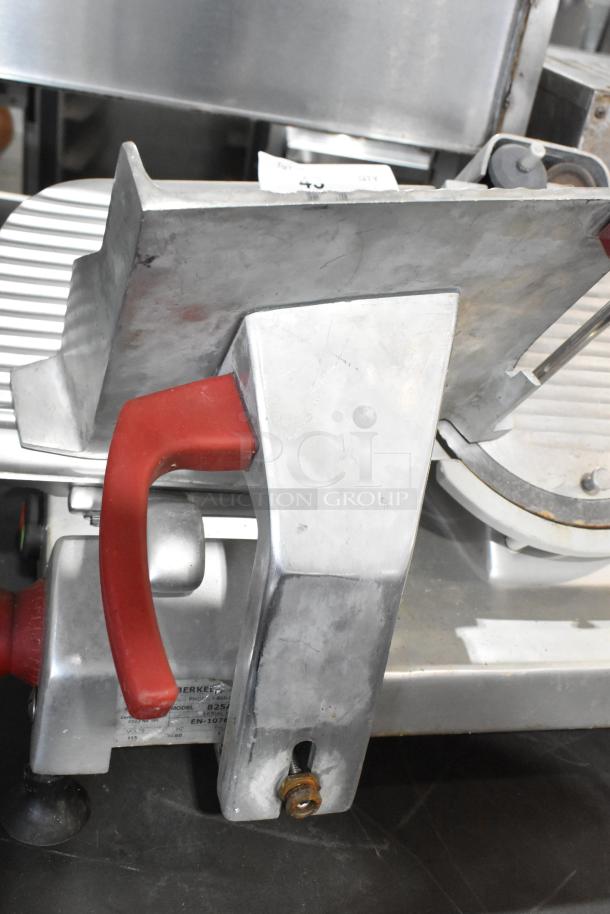 Berkel 825A-PLUS commercial meat slicer with blade sharpener. Metal, 115V, 1 phase. Visible label detailing model and voltage.