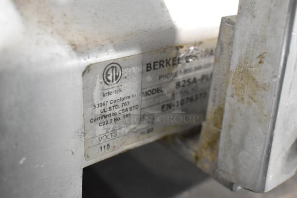 Berkel 825A-PLUS meat slicer label showing model and voltage, 115V, certified to CSA standard. Visible wear on surface.