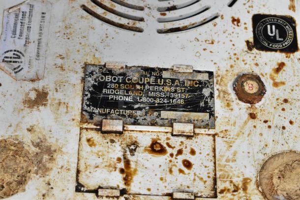 Rusted label of Robot Coupe R2 food processor with visible UL certification and manufacturer details.