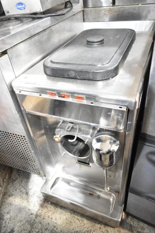 Taylor stainless steel commercial frozen beverage machine with mixing attachment, 208-230V, 1 phase, good condition.