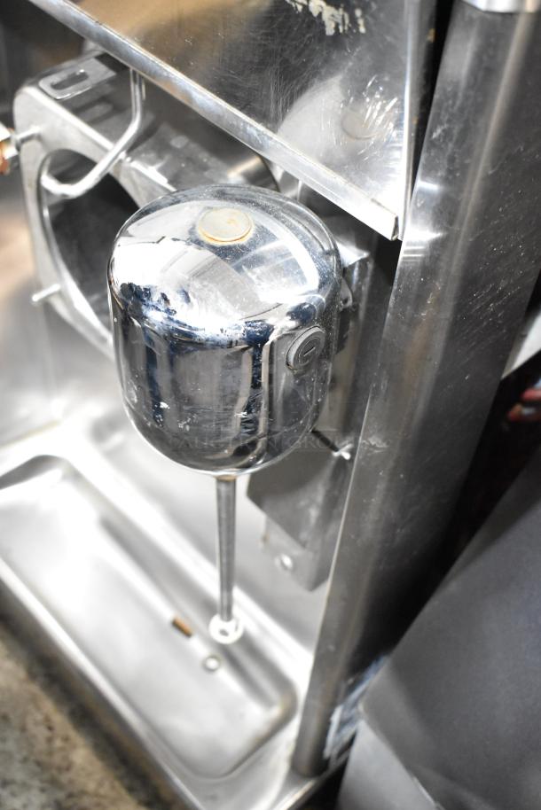 Taylor stainless steel commercial frozen beverage machine with mixing attachment, 208-230V, 1 Phase, good condition.