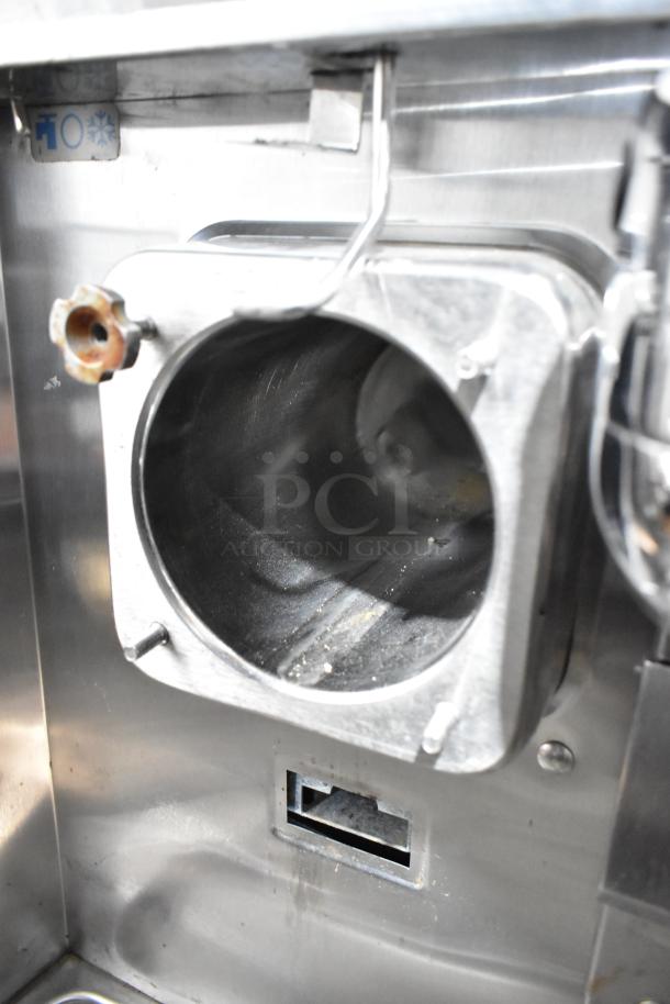 Taylor stainless steel frozen beverage machine, single flavor, with drink mixing attachment. Marked 208-230V, 1 phase.