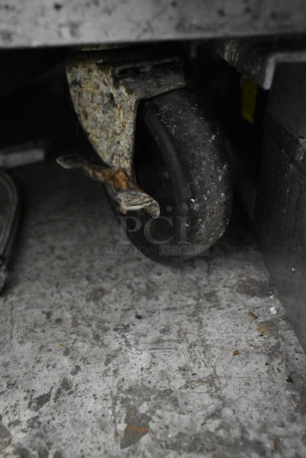 True stainless steel commercial undercounter cooler with two drawers. Features commercial casters, 115 volts, 1 phase.