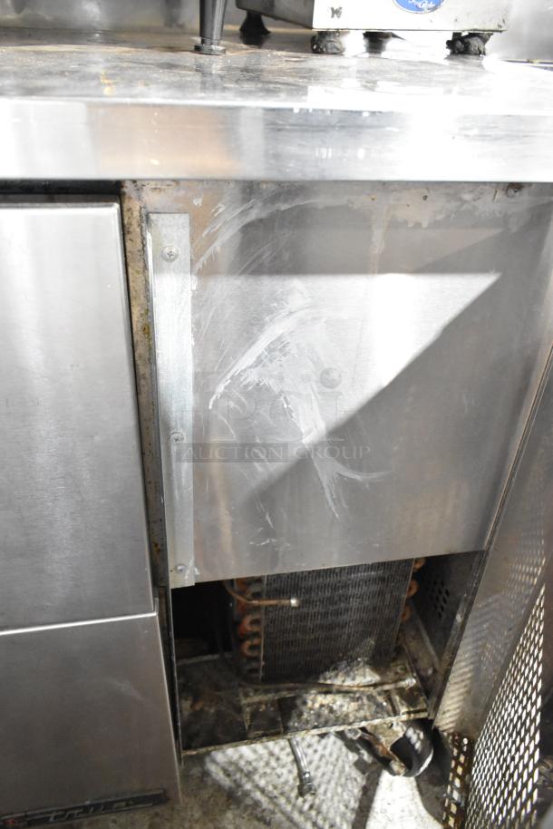 True stainless steel 2-drawer undercounter cooler, commercial casters, 115V, 1 phase, visible wear and cleaning marks.