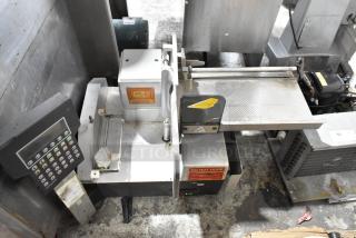 Bizerba Metal Commercial Countertop Meat Slicer Stacker, with keypad, metal tray, and caution labels visible; used condition.