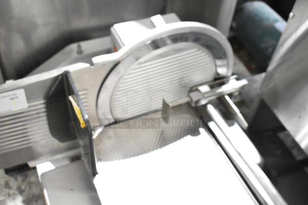 Bizerba commercial countertop meat slicer stacker, stainless steel, used condition, visible control panel and slicing blade.