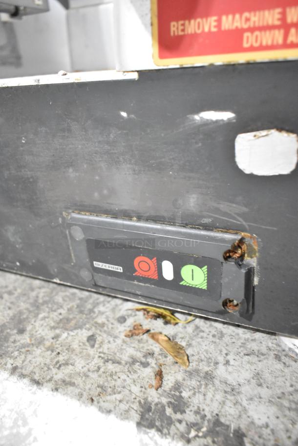 Bizerba metal commercial countertop meat slicer stacker showing power buttons with visible wear and corrosion.