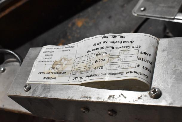 Continental F412502 metal evaporator tray, 120V, 1 phase, visible label detailing specs and part number, used condition.
