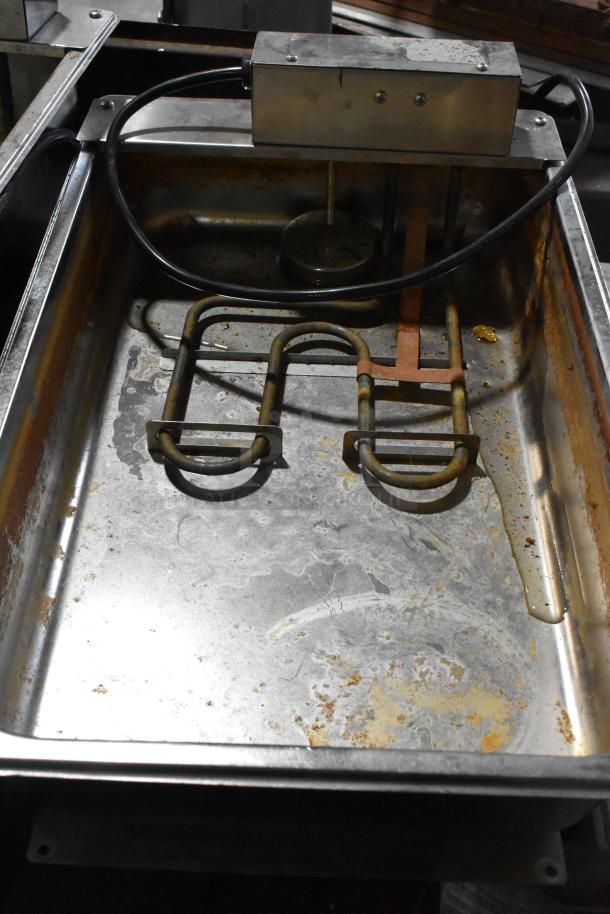 Continental F412502 metal evaporator tray, 120 volts, 1 phase, used condition with visible rust and heating element. Three trays available.