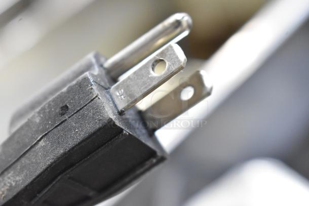 Close-up of a power plug for the Continental F412502 metal evaporator tray, 120 volts, 1 phase.