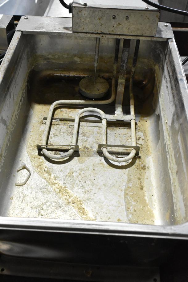 Continental F412502 metal evaporator tray, 120 volts, 1 phase, used condition with visible wear, dirt, and corrosion.