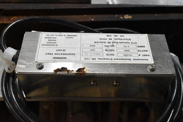 Continental F412502 metal evaporator tray, 120V, 1 phase. Label details voltage and part number. Slight rust visible.