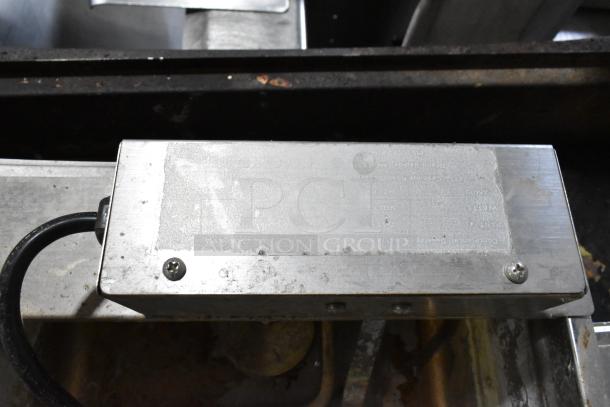Continental F412502 metal evaporator tray, 120V, 1 phase, showing surface wear and visible wiring.