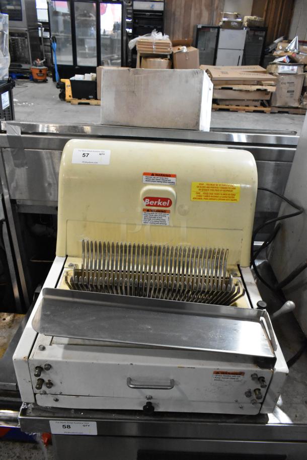 Berkel MB 7/16 metal commercial countertop bread loaf slicer, 115 volts, 1 phase, in used condition. Labels with warnings visible.