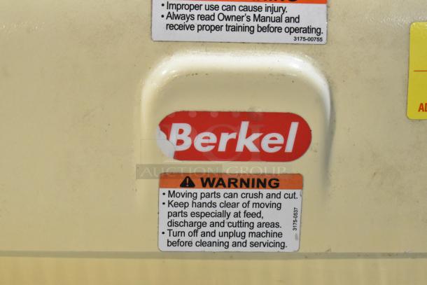 Berkel MB 7/16 metal commercial bread slicer with warning label. Voltage: 115V, Phase: 1. Visible wear on Berkel logo.
