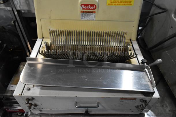 Berkel MB 7/16 metal bread loaf slicer, countertop model. Good condition, visible Berkel logo and safety warning. 115V, 1 phase.