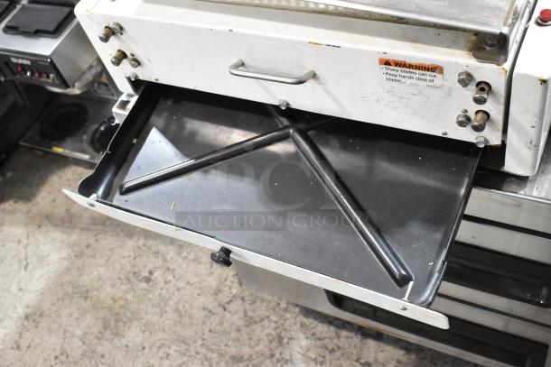 Berkel MB 7/16 metal commercial bread slicer, 115V, 1 phase. Visible warning label. Used condition.