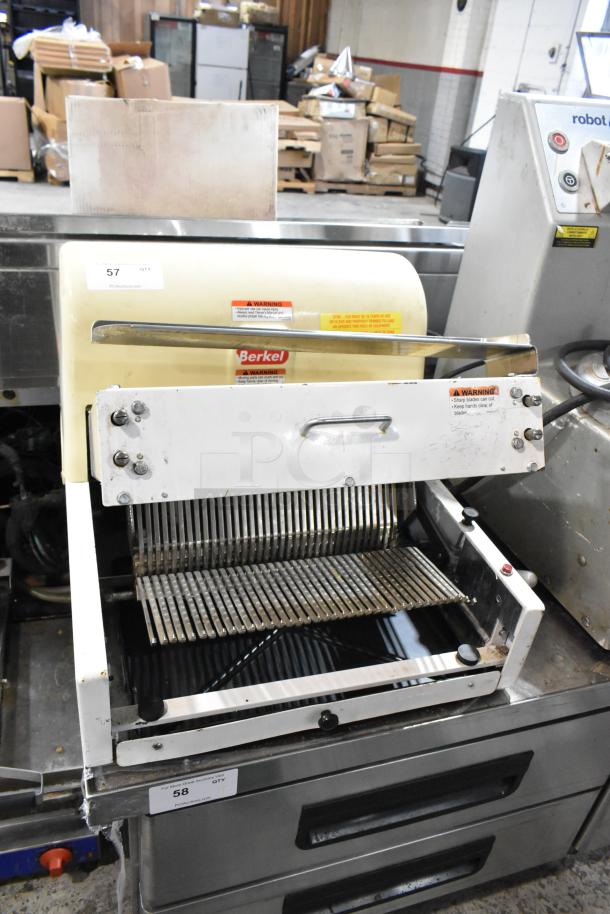 Berkel MB 7/16 metal commercial bread slicer on countertop, 115V, 1 phase. Visible warning labels. Used condition.
