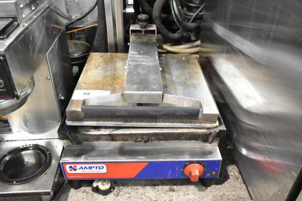 2021 Ampto SSGL Metal Commercial Panini Press, 120V, 1 Phase. Visible wear on plates; Ampto label on front. Model SSGL.