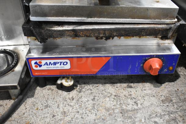 2021 Ampto SSGL metal panini press, commercial countertop model, visible wear, 120 volts, 1 phase, heavy-duty label.