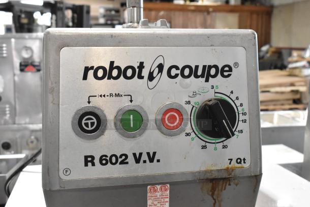 Robot Coupe R602 V.V. commercial food processor base. Metal construction, controls visible. 120V, 1 phase, 7 Qt capacity.