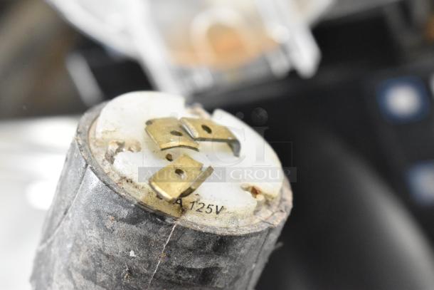 Close-up of a worn electrical component labeled "A 125V," likely part of a Bunn ULTRA-2 beverage machine.