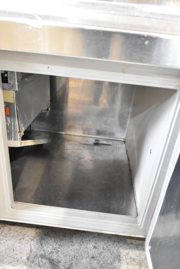 Randell 51395PR stainless steel pizza prep table, 2 doors open, commercial casters visible. 115 volts, 1 phase.