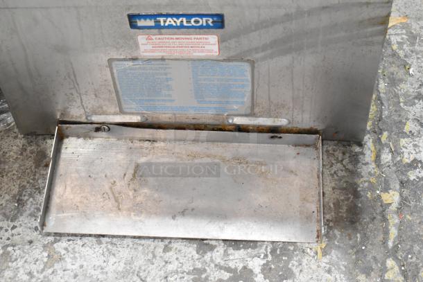 Taylor 432-27 stainless steel countertop slushie machine. Features two flavors; 208-230V, 1 phase. Visible wear and labels.