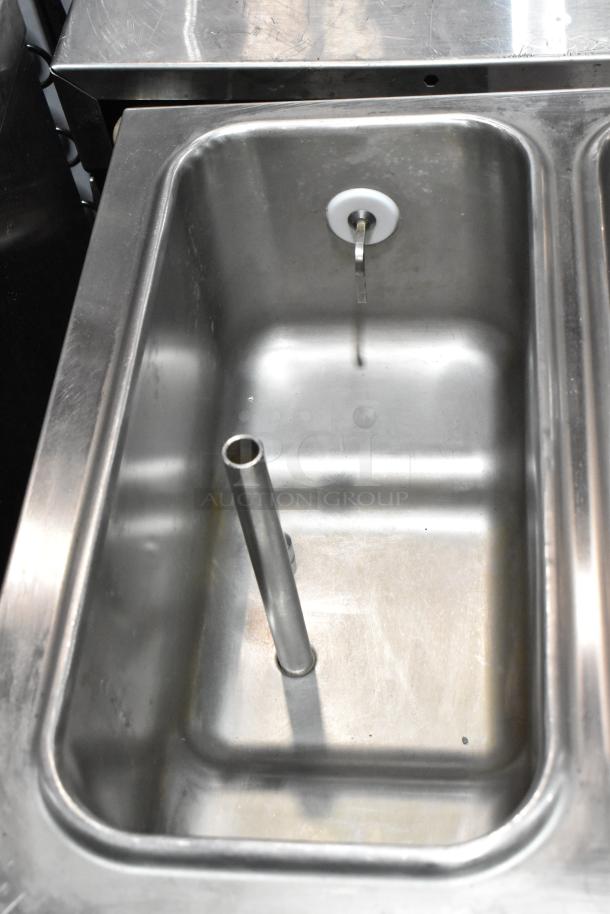 Taylor 432-27 stainless steel commercial 2-flavor slushie machine interior. Features durable construction, 208-230 volts, 1 phase.