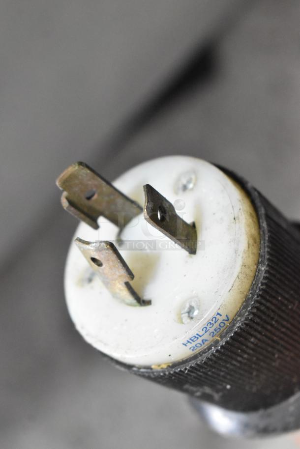Close-up of a power plug for the Taylor 432-27 slushie machine, marked 20A 250V, showing prongs and label.
