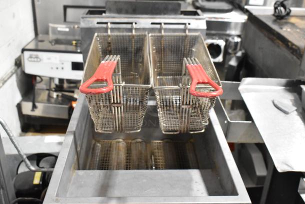 Cook Rite ATFS-40 stainless steel natural gas fryer, 102,000 BTU, with 2 metal fry baskets, commercial kitchen setting.