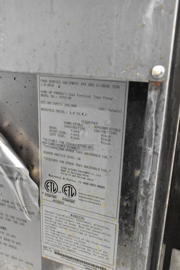 Cook Rite ATFS-40 stainless steel commercial deep fryer, natural gas, 102,000 BTU, includes 2 fry baskets, visible label with specs.