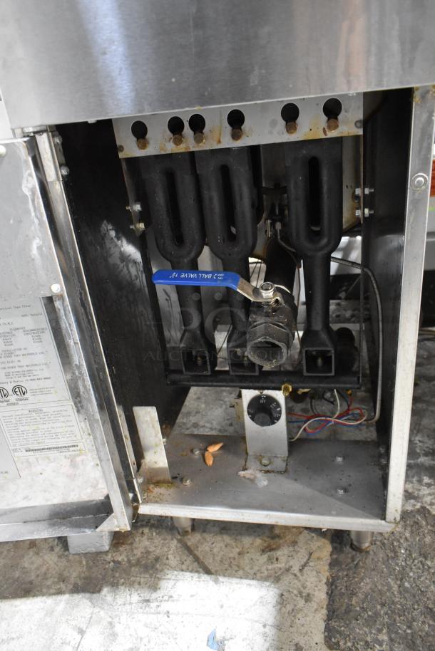 Cook Rite ATFS-40 stainless steel commercial deep fat fryer, natural gas, 102,000 BTU, with 2 metal fry baskets. Visible wear.