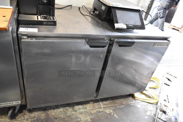 Beverage Air UCR48A stainless steel undercounter cooler with two doors, on commercial casters; robust condition. Model label visible.