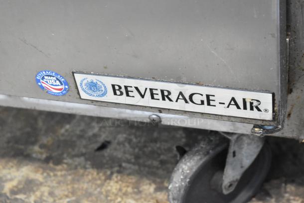 Beverage Air SPE48-18M stainless steel prep table, shown with logo and "Made in USA" marking. Features commercial casters.