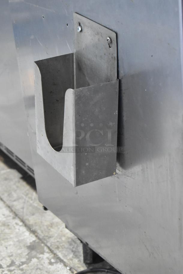 Beverage Air SPE48-18M stainless steel prep table, sturdy casters, 115V, 1 Phase, minor wear, ideal for commercial use.