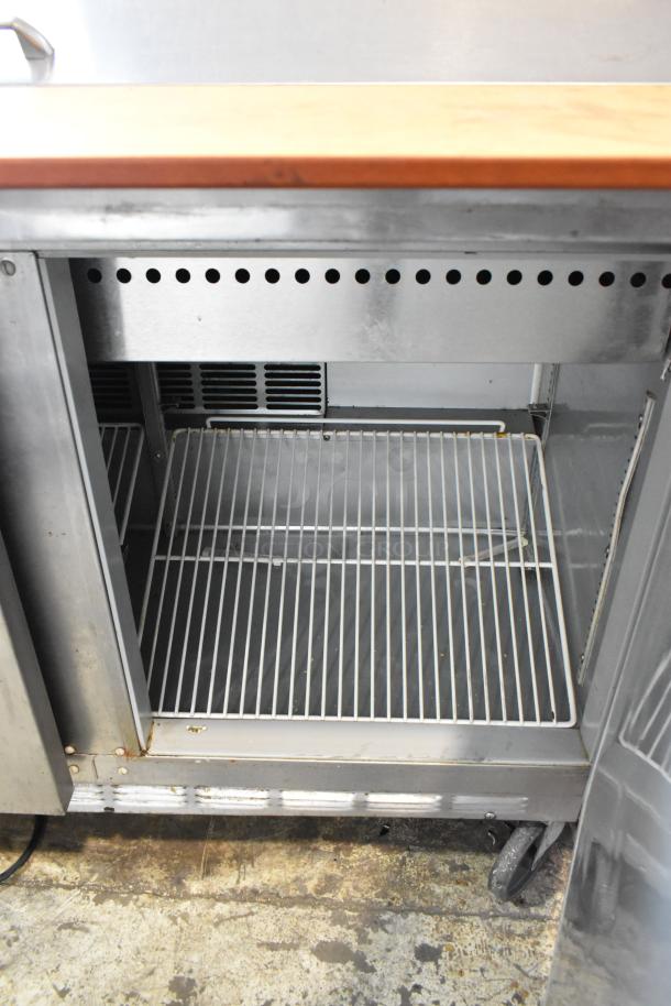 Beverage Air SPE48-18M stainless steel sandwich prep table on casters. Features wire shelving, bain marie mega top, 115V, 1 phase.