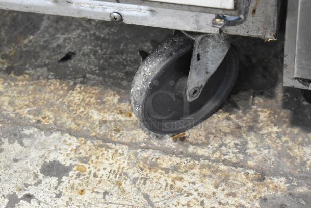 Beverage Air SPE48-18M commercial prep table on caster wheel, stainless steel, 115 volts, 1 phase, used.