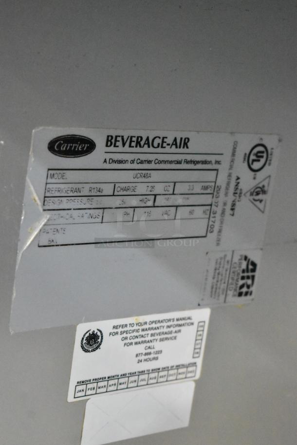 Beverage Air UCR48A commercial cooler, stainless steel, with labels detailing refrigerant R134a, charge 7.25 oz, 115V.