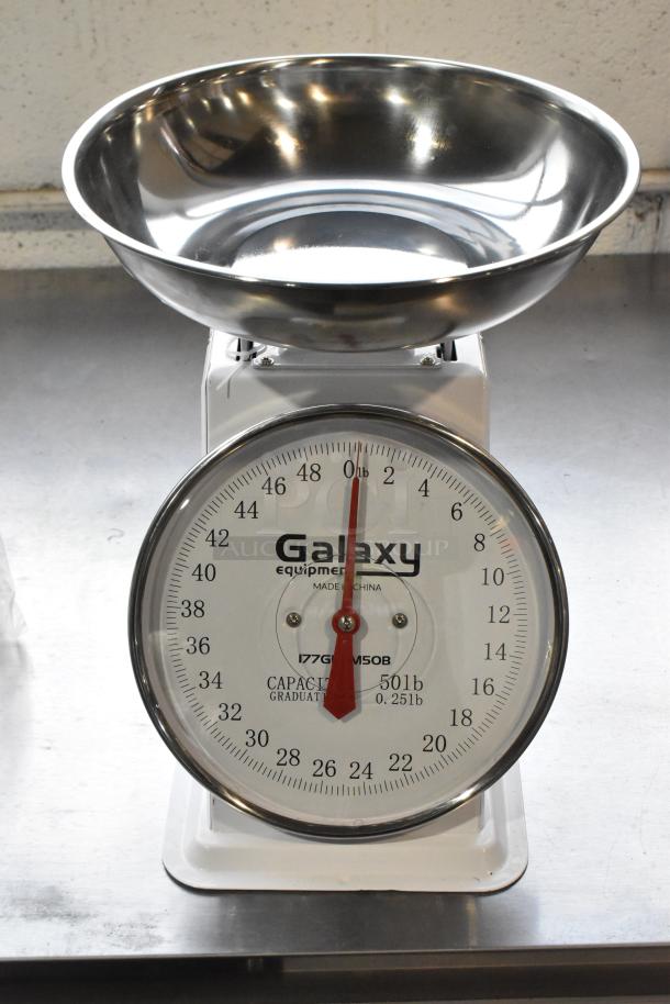 Galaxy metal countertop food portioning scale, 50 lb capacity, clear dial, stainless steel bowl, excellent condition.