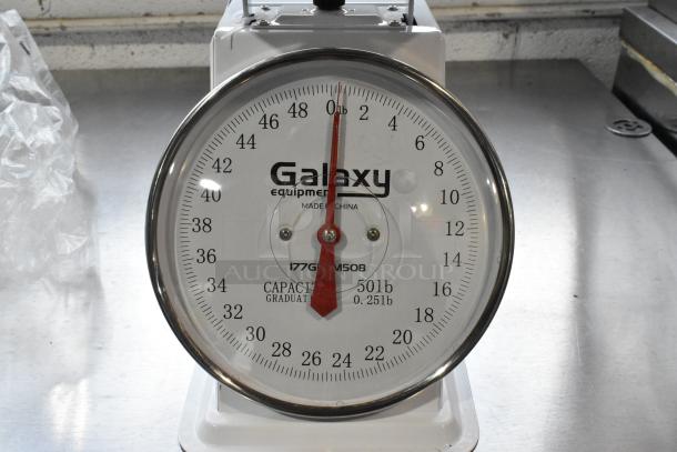 Galaxy Metal Countertop Food Portioning Scale, 50lb capacity, clear dial, red pointer, in excellent condition.